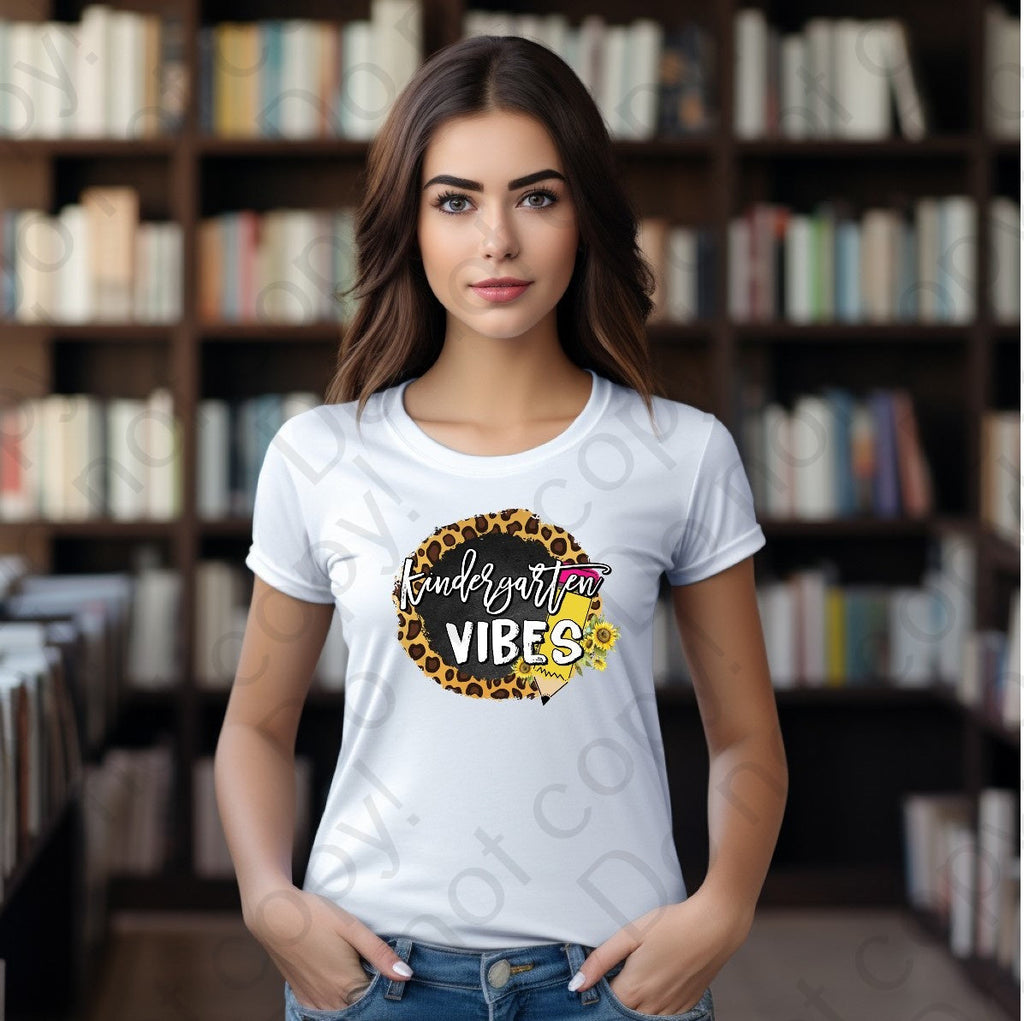 08-127 Kindergarten Vibes with a pencil and a cheetah print background Completed Tee