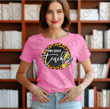 Load image into Gallery viewer, 08-140 Third grade teacher with a pencil and a cheetah print background Completed Tee
