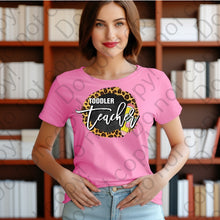 Load image into Gallery viewer, 08-141 Toddler teacher with a pencil and a cheetah print background Completed Tee
