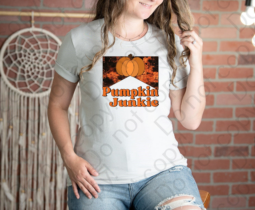 11-56 Pumpkin junkie with a big pumpkin and a orange and red background Completed Tee